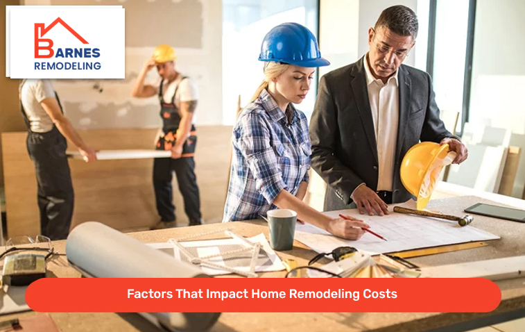 Homeowner discussing construction plans and home remodeling cost factors with contractor